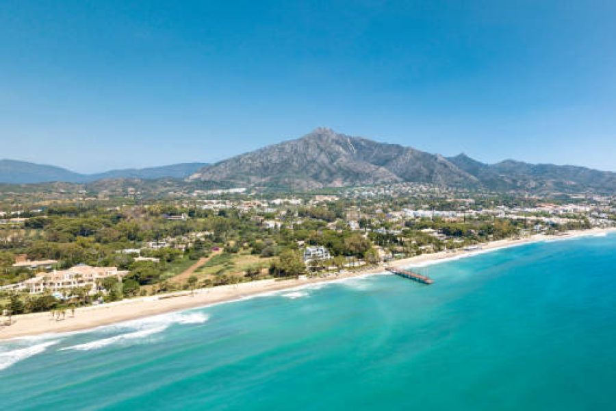 Panoramic aerial view of Casablanca  and Puente Romano beach Marbella, Famous destination with luxury proprieties and restaurants. View of  wood bridge Puente Romano and mountain La Concha.