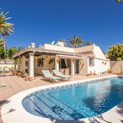 Charming Beachside Bungalow with Renovation Potential in Carib Playa